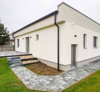 A family house in Branovo with a terrace, paved area, and green land.
