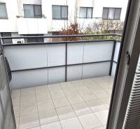 The balcony of a 1-room apartment in Bratislava - Janíkov dvor with a view of neighboring buildings.