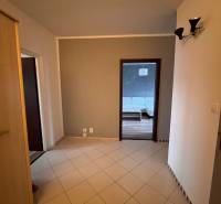 Hallway in a 2-room apartment with a view of the floor with a wooden decor.