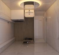 Compact bathroom in a 3-room apartment with marble tiles and a wooden decor floor.