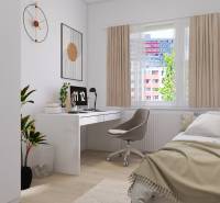 A cozy room in a 3-room apartment with a desk and a single bed, wooden decor flooring.