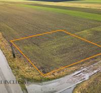 Plots - housing in Kostolné Kračany on Šipošovská Kračany, surrounded by agricultural land.