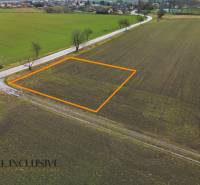 Plots - housing in Šipošovské Kračany in Kostolné Kračany, surrounded by fields and a road.