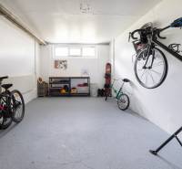Storage space with bicycles and shelves in a 3-room apartment.