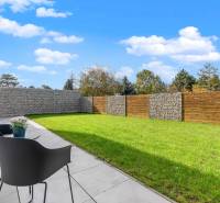 A garden at a 3-room apartment on Lipnicka Street in Dunajska Luzna, with modern fencing.