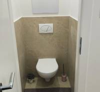 Bathroom in a 4-room apartment with tiles and a toilet.
