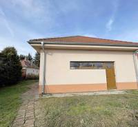 A family house on Hodská Street in Galanta with a simple garden and a brick walkway.
