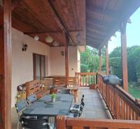 The terrace of a family house on Hodská Street in Galanta with seating and wooden elements.