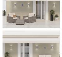 The terrace of the 3-room apartment with seating, decorations, and plants offers a pleasant relaxation space.