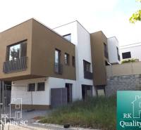 3-bedroom apartment at Sunny Lakes South, Senec with modern architecture and a garden.