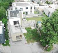 Aerial view of a 3-room apartment in Senec, Sunny Lakes South, surrounded by greenery and modern buildings.