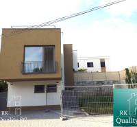 Two-story house near Sunny Lakes South, Senec, with a modern facade and parking area.