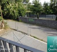 View from a 3-room apartment on Slnečné jazerá Juh Street, Senec, with fencing and greenery.