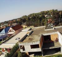 A residential area with family houses in Kráľová pri Senci - Záhumenská, Senec, with greenery and a built-up plot.