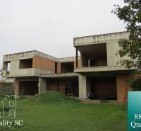 Unfinished family house on Kráľová Street near Senec - Záhumenská, Senec, surrounded by greenery.