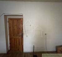 Wooden doors in the interior of a family house with a floor featuring a wood decor.