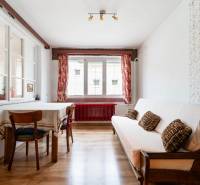 Interior with a sofa, table, and chairs; floor with a wood decor. Family house.