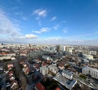 A view of the Bratislava skyline in the Old Town area with high-rise buildings and houses.