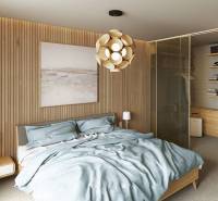 Bedroom in a 4-room apartment with a wood-paneled wall and a wardrobe.