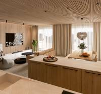 In the 4-room apartment, there is a kitchen with a dining area and a living section, with a wooden decor floor.