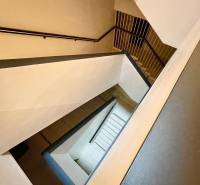 A view of the staircase leading down in a residential building of a 2-room apartment.