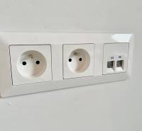 Double electrical outlet and two ethernet ports on the wall.