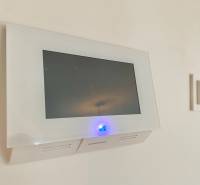 Display with a blue indicator and control panel in a 2-room apartment.