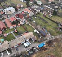 Aerial view of rural houses and gardens in the village of Kláštor pod Znievom.