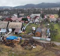 Rural development with a courtyard in Kláštor pod Znievom surrounded by orchard gardens.