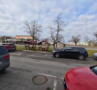 Parking on Obchodná Street in Michalovce near the dining areas with gazebos.