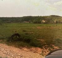 Lands - housing on Poľnohospodárska in Trenčín with a meadow and trees on the horizon.