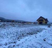 Snow-covered landscape on plots in Trenčín on Poľnohospodárska Street suitable for living.