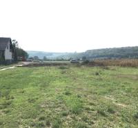 Countryside near Trenčín on Poľnohospodárska Street, surrounded by fields suitable for residential plots.
