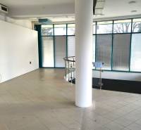 Commercial premises with ceramic tiles, glass walls, and spiral stairs.