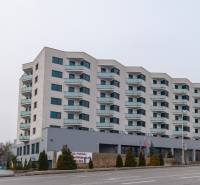 Apartment building on Rybničná Street in Bratislava - Vajnory, ground floor with wooden decor.