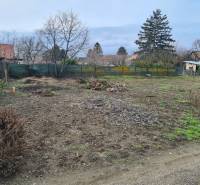 Plots - residential in the village of Svätý Peter with grassy and overgrown areas.