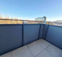 A balcony in a 2-room apartment with a view of the Poprad panorama in sunny weather.
