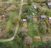 Aerial view of cottages around Hlohovec with surrounding gardens and trees.