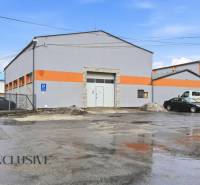 Commercial premises on Pod kalváriou Street in Topoľčany with parking and loading gates.