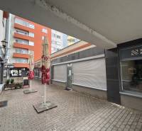 Commercial premises on Lichnerova Street in Senec with outdoor terraces and interlocking paving.