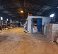 Interior of the warehouse with stored materials and equipment on Lieskovská cesta in Zvolen.