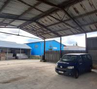 Open storage area on Lieskovská cesta in Zvolen with parked vehicles.