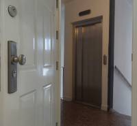 2-bedroom apartment with a view of the elevator and entrance doors.