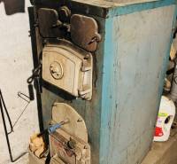 A fireplace in the basement of a family house in Horná Ves, on a stand with storage space.