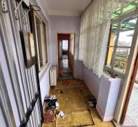 Interior of a family house with a wooden decor floor and a row-like space.