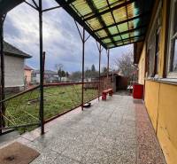 A family house in Komjatice with a terrace and a view of the garden.