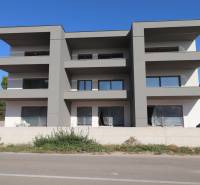 The exterior of a newly built holiday apartment in the town of Vodice with a modern facade.