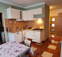 Kitchen in a 3-room apartment with a kitchen unit, hob, and coffee maker.
