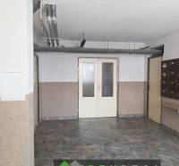 The entrance hall of the apartment building on Venevská Street in Veľký Krtíš with mailboxes.