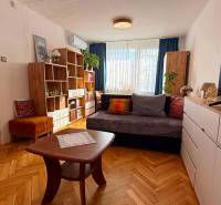 Living room in a 3-room apartment with a sofa and furniture, floor with wood decor.